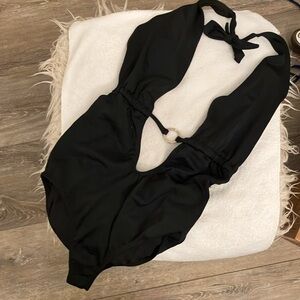 Drop neckline black sexy one piece with scoop back and silver circle enclosure